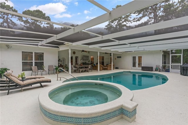 117 Serenoa Dr, Brunswick, GA 31523 - view of swimming pool featuring french doors, ceiling fan, a patio, and glass enclosure