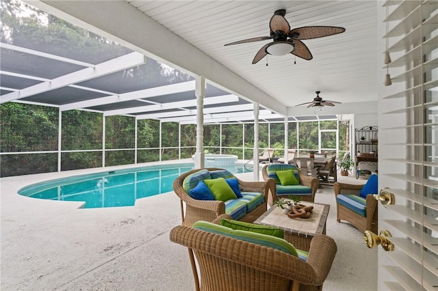117 Serenoa Dr, Brunswick, GA 31523 - view of pool featuring an outdoor living space, a ceiling fan, a patio, a pool with connected hot tub, and glass enclosure