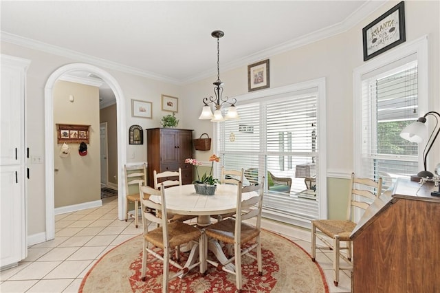 117 Serenoa Dr, Brunswick, GA 31523 - dining space featuring arched walkways, ornamental molding, and light tile patterned floors
