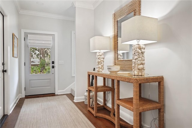 entryway with baseboards, dark wood-style floors, and crown molding