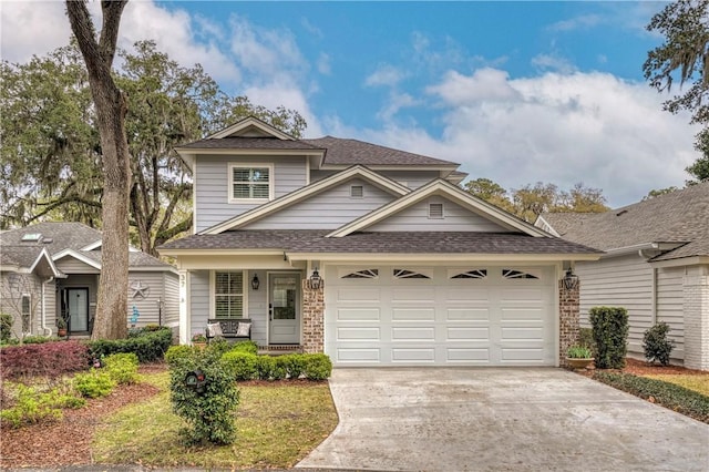 view of front of house featuring roof with shingles, a porch, an attached garage, concrete driveway, and brick siding