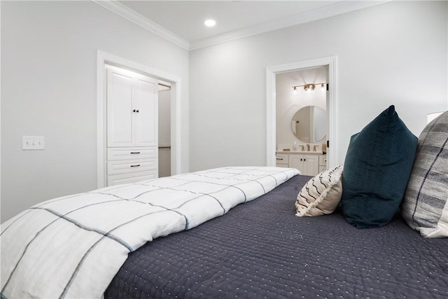 bedroom featuring recessed lighting, ensuite bathroom, and crown molding