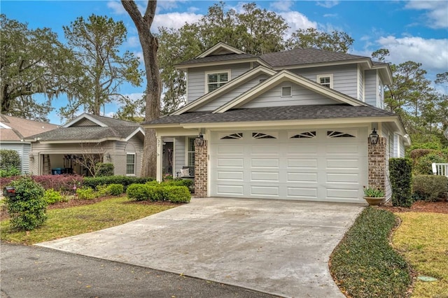 traditional home featuring concrete driveway, brick siding, and a shingled roof