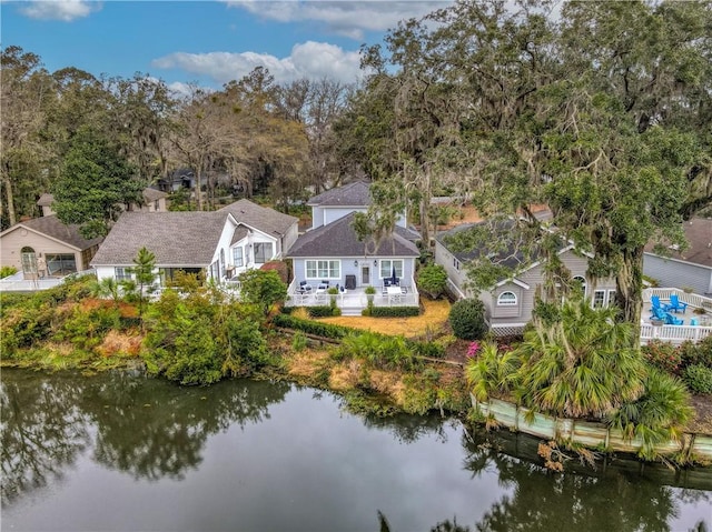 birds eye view of property with a water view