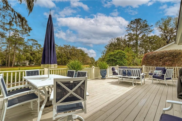 deck with an outdoor living space and outdoor dining area