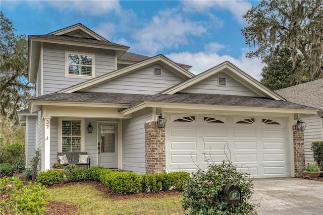 view of front of home with a porch, concrete driveway, a shingled roof, a garage, and brick siding