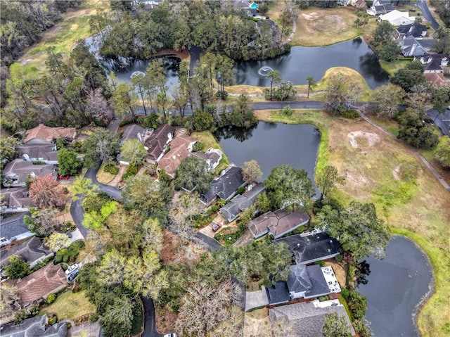 bird's eye view with a residential view and a water view