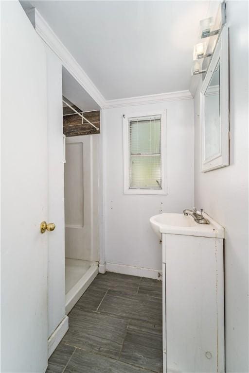 1007 Atlantic Ave, Waycross, GA 31501 - bathroom featuring vanity, a shower, and ornamental molding
