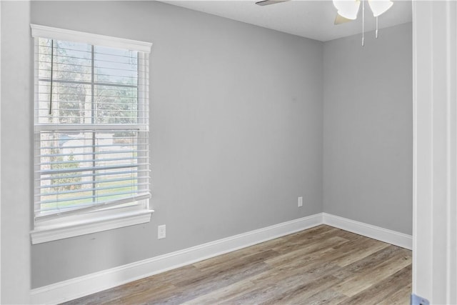 unfurnished room featuring hardwood / wood-style flooring, plenty of natural light, and ceiling fan