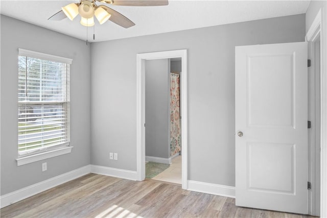 unfurnished bedroom with light hardwood / wood-style flooring and ceiling fan