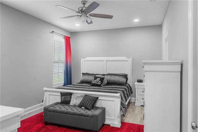 bedroom featuring ceiling fan and light hardwood / wood-style flooring