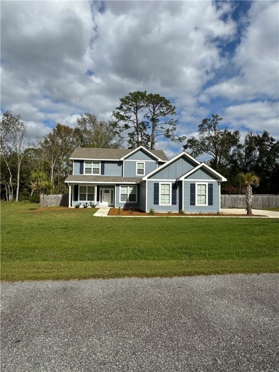 view of front of property with a porch and a front yard