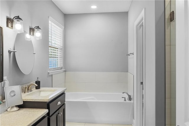 bathroom with a bathtub and vanity