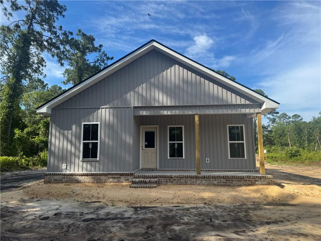 158 N Deborah Cir, Jesup, GA 31546 - view of front of home featuring a porch and board and batten siding