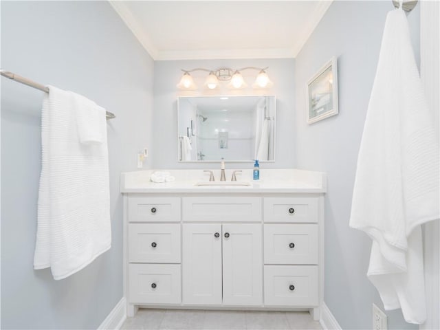 bathroom featuring vanity, crown molding, and a shower