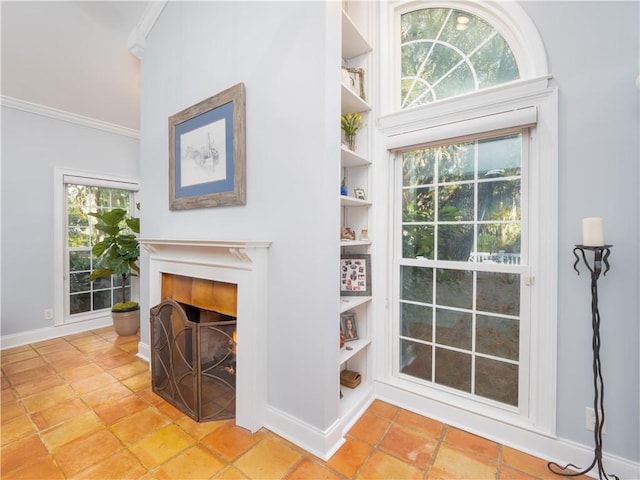 interior details with crown molding and built in features