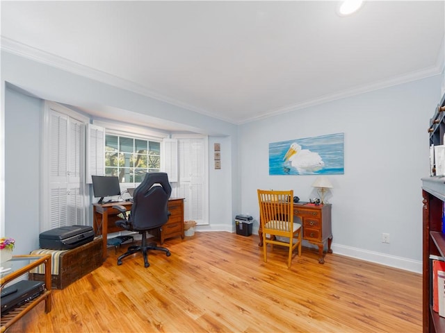 office area with ornamental molding and light hardwood / wood-style flooring