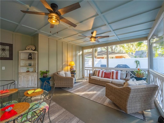 sunroom / solarium featuring coffered ceiling and ceiling fan