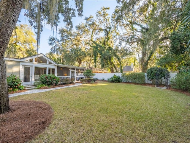 view of yard featuring a sunroom