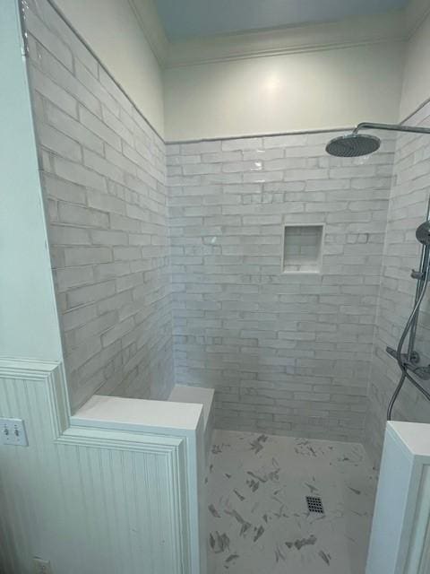 full bath featuring tiled shower