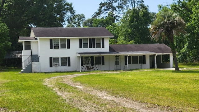 view of front of home with a front yard and a porch