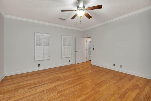 unfurnished room with ceiling fan, light hardwood / wood-style floors, a textured ceiling, and ornamental molding