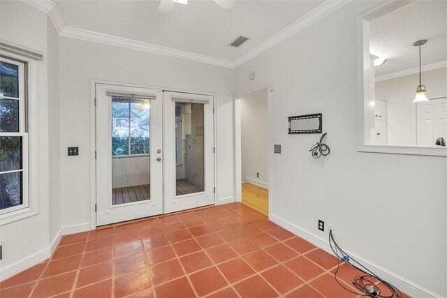 doorway with french doors, ceiling fan, and ornamental molding