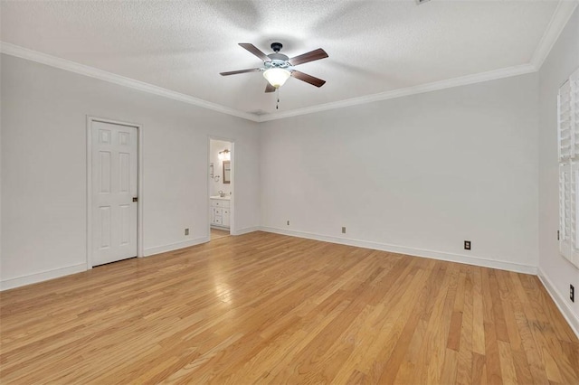 unfurnished room featuring a textured ceiling, light hardwood / wood-style floors, ceiling fan, and ornamental molding