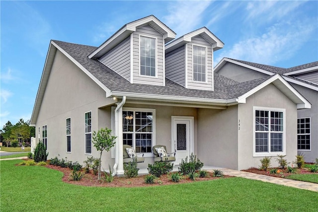 view of front facade featuring a front yard and a porch