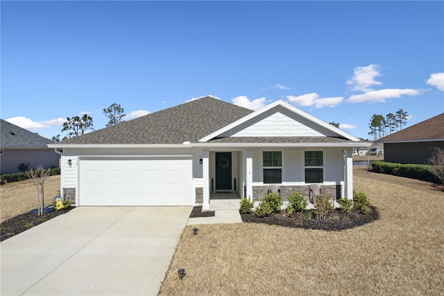 view of front facade featuring a garage and covered porch