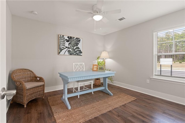 home office with dark hardwood / wood-style floors and ceiling fan