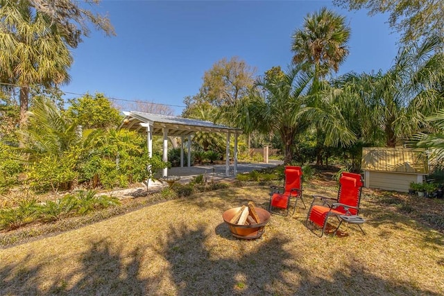 view of yard with a gazebo, a fire pit, and a patio