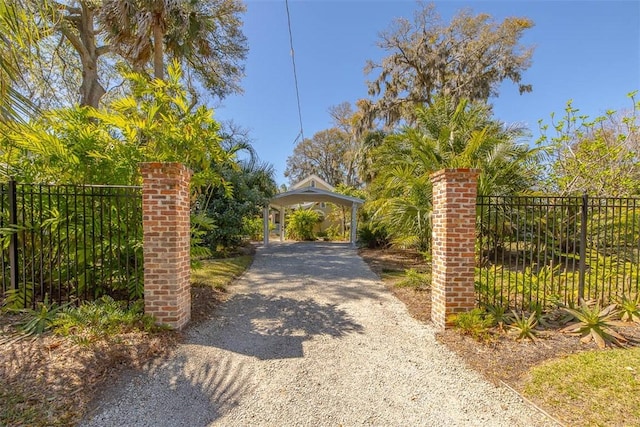 view of gate with fence