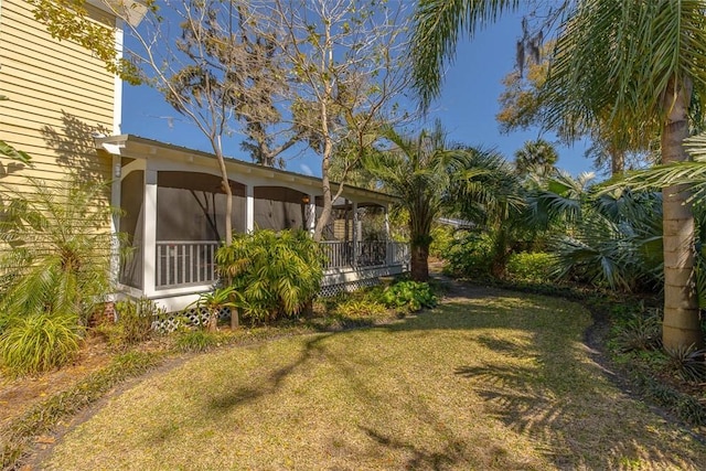 view of yard with a sunroom