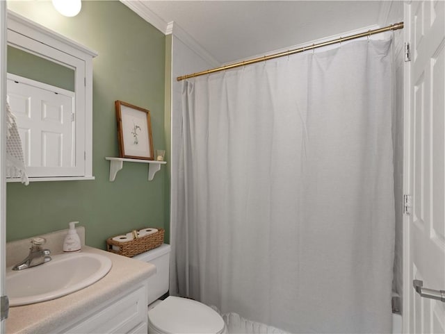 bathroom with a shower with curtain, vanity, toilet, and ornamental molding