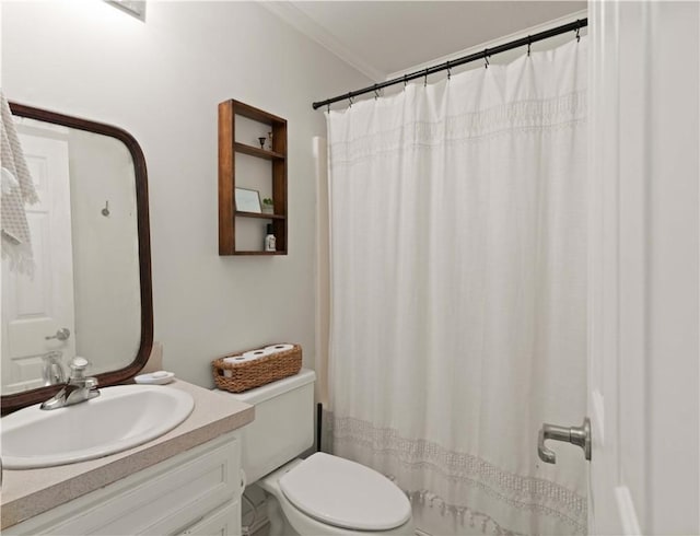 bathroom featuring vanity, toilet, crown molding, and walk in shower