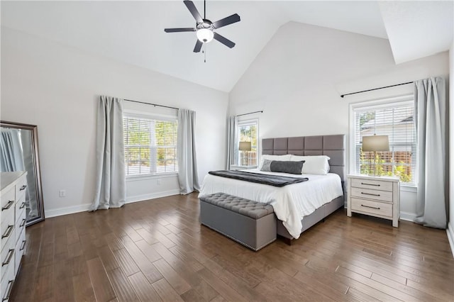 bedroom with high vaulted ceiling, ceiling fan, and dark wood-type flooring