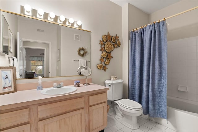 full bathroom featuring tile patterned floors, vanity, shower / tub combo, and toilet