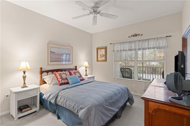 bedroom with ceiling fan and light colored carpet