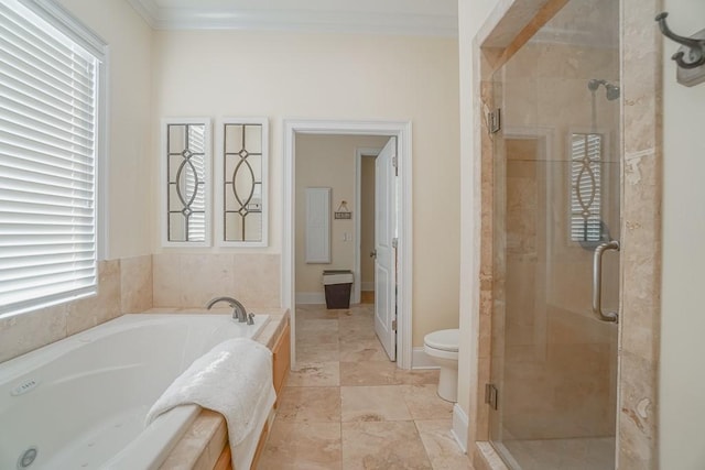 bathroom featuring toilet, ornamental molding, and shower with separate bathtub