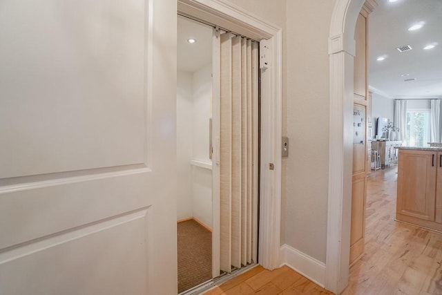 bathroom with wood-type flooring