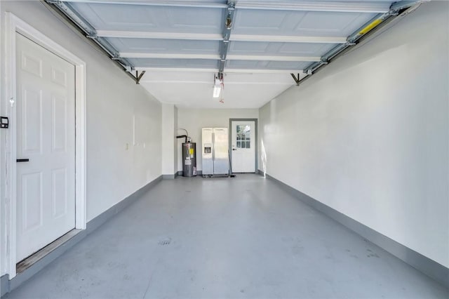 garage featuring white refrigerator with ice dispenser and water heater