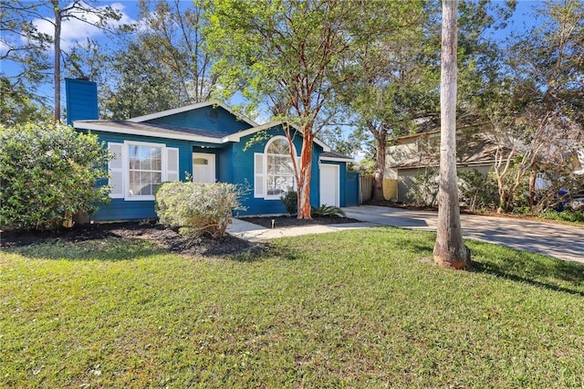 view of front facade featuring a front yard and a garage