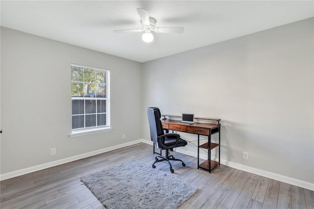 office space featuring ceiling fan and hardwood / wood-style floors