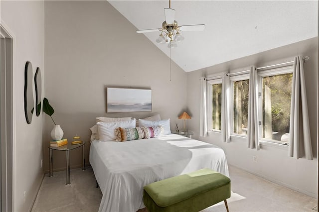 bedroom featuring ceiling fan, light colored carpet, and high vaulted ceiling