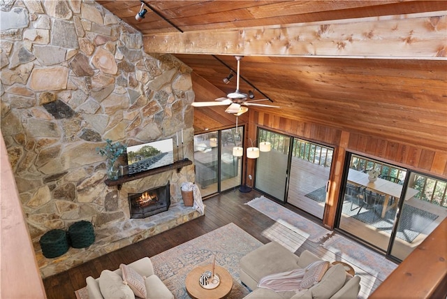 living room with wooden ceiling, wooden walls, ceiling fan, dark hardwood / wood-style floors, and a fireplace