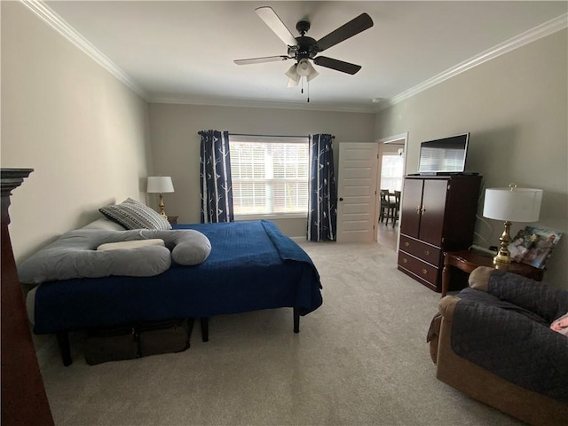 bedroom featuring ornamental molding, light colored carpet, and ceiling fan