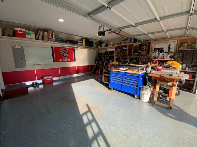 garage featuring a garage door opener and a workshop area