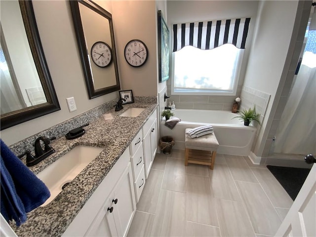 bathroom with a bathing tub and vanity