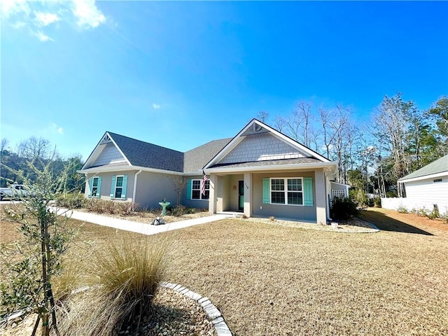 view of front of property with a front lawn